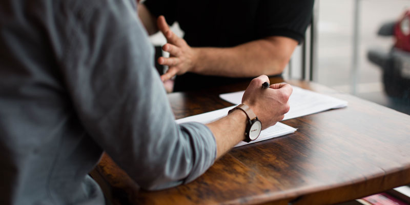 two people in a discussion meeting