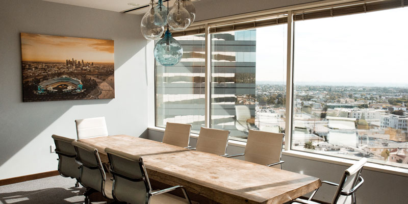 office conference room with large windows on high level of skyscraper during daytime