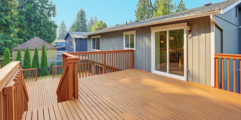 empty walkout deck with stain-finished redwood railings