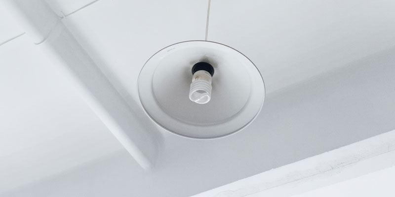 white ceiling with light fixture hanging overhead