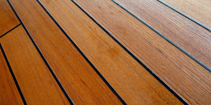 wet stained teakwood deck