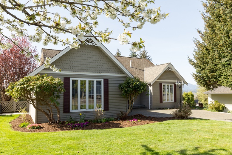 professionally painted house exterior protected from spring weather