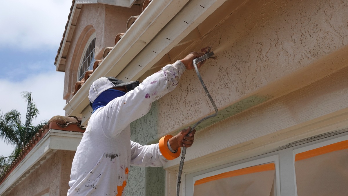 professional exterior painter painting stucco