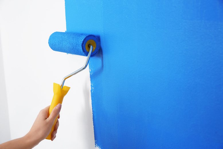 DIY painter using high-quality paint for interior painting project