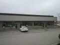 front of retail center after paint and before signs installed