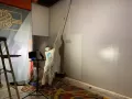 professional painter painting an interior wall