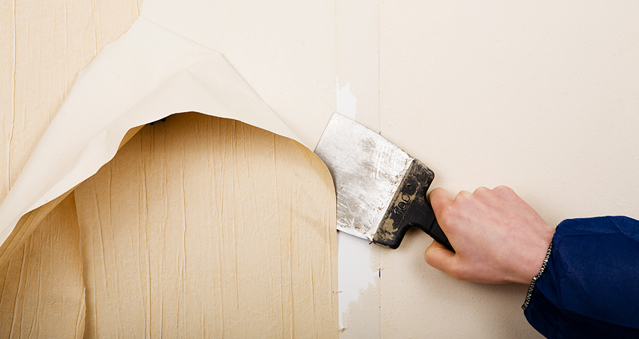 Painter Removing Wallpaper