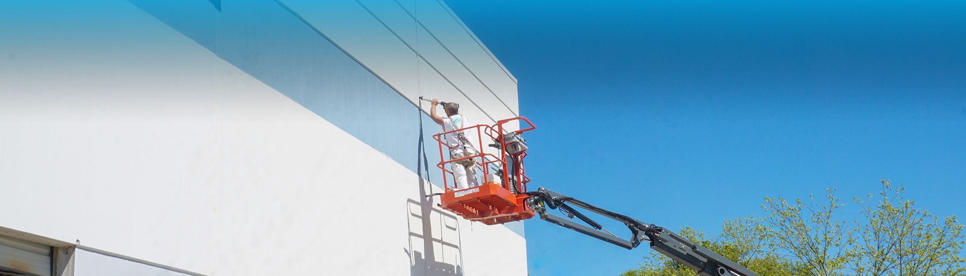painter caulking a commercial building expansion joint